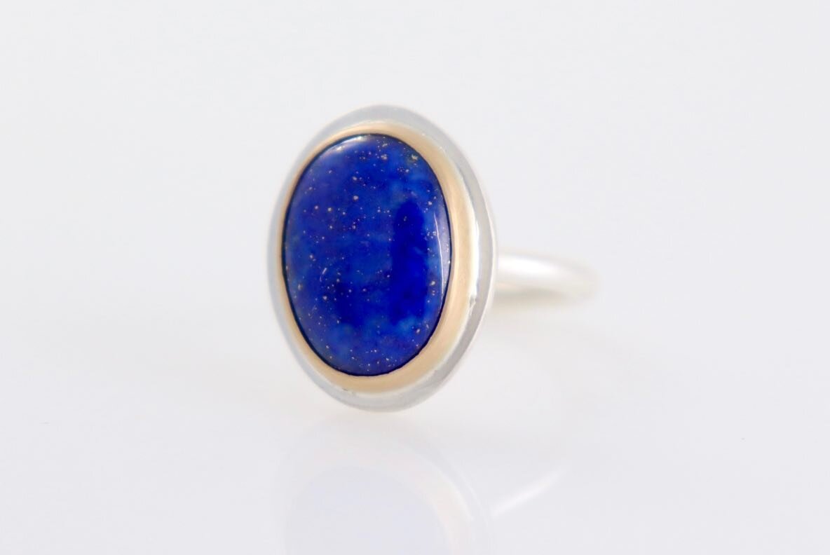 Something new. Something blue. Something true.

Recycled 14 kt yellow gold. 
Recycled sterling silver. 
Chilean Lapis from @columbiagemhouse 
Size 7 

I can&rsquo;t get over the depth and brilliance of this stone! It is important for me to know where