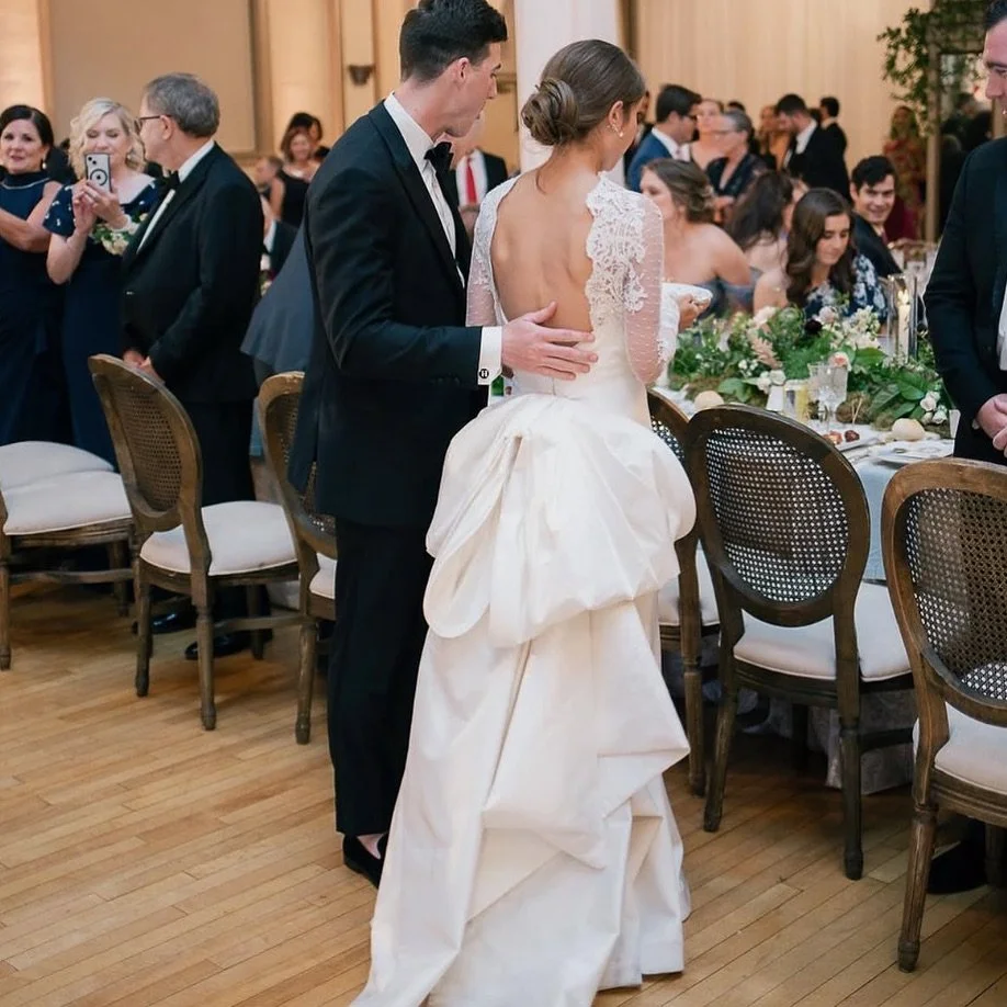That back! AND if that wasn&rsquo;t enough, after the first dance, the bride removes the overblouse and detachable bow and voila&hellip;. It reveals a completely different style, Romona KEVEZA&rsquo;S famous 5 ply silk crepe dress to dance the night 