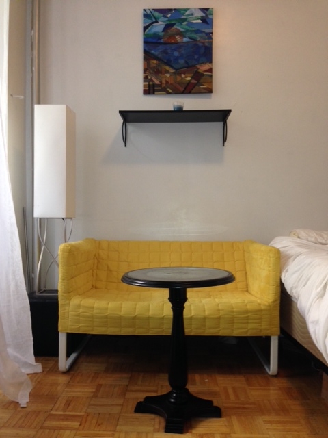 Yellow Ikea Couch = $99. Ikea Shelf = $14. Pier 1 Table = already owned. Pier 1 Lamp = already owned.