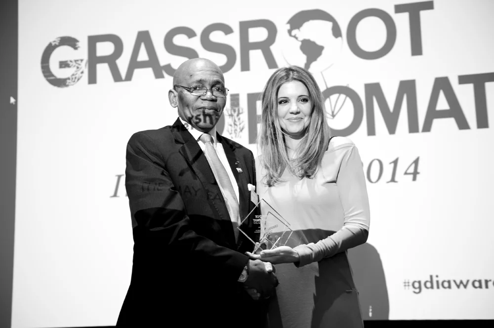 Dr Linda Papadopoulos with Sierra Leone High Commissioner HE Edward Turay