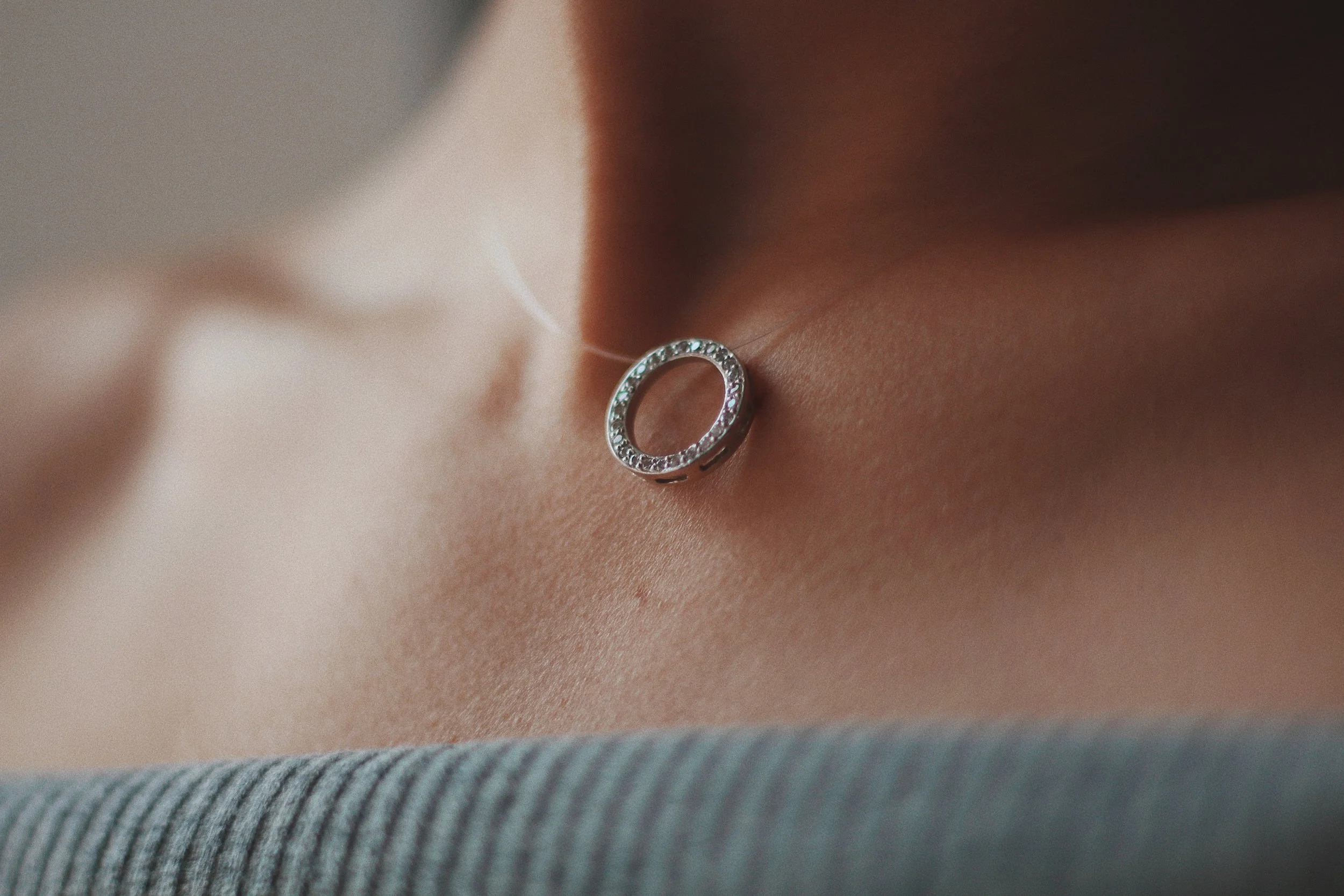closeup-shot-female-wearing-beautiful-silver-necklace-with-pendant.jpg