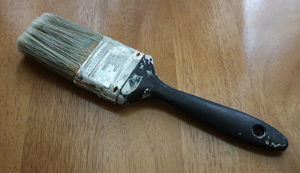 A brush like this: cheap and well-used will work fine.