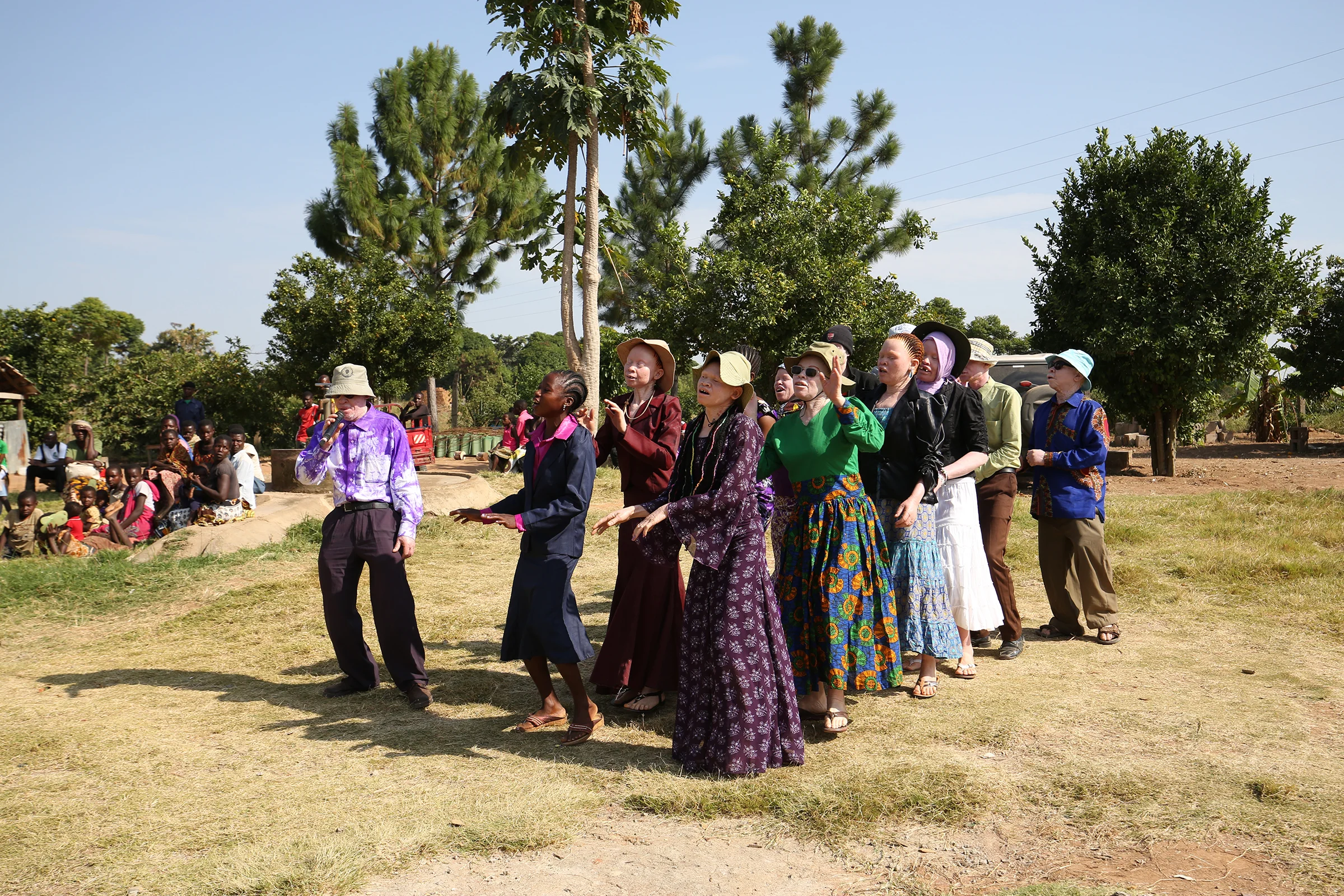  The Tanzania Albinism Collective sing to their community about their plight on International Albinism Day at The Umoja Training Centre (UTC). 