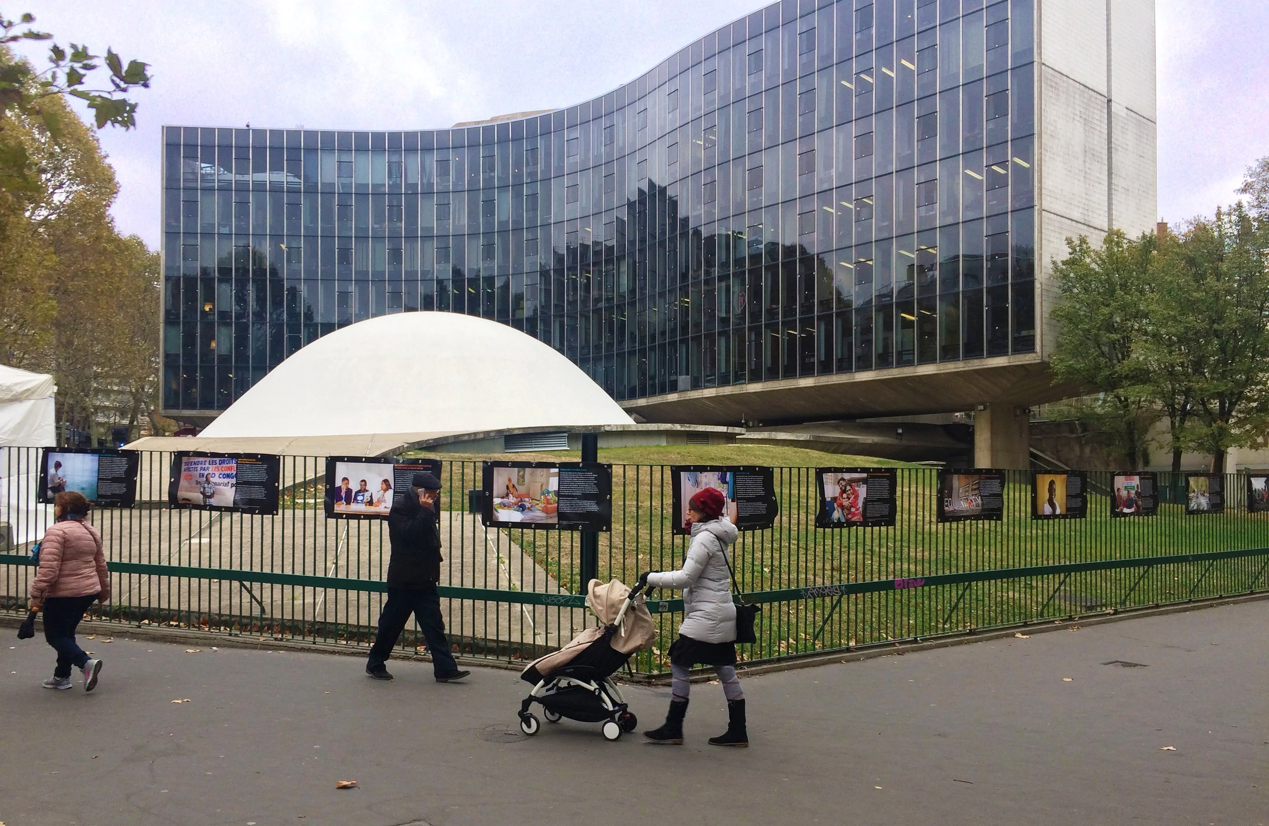 People interacting with outdoor posters