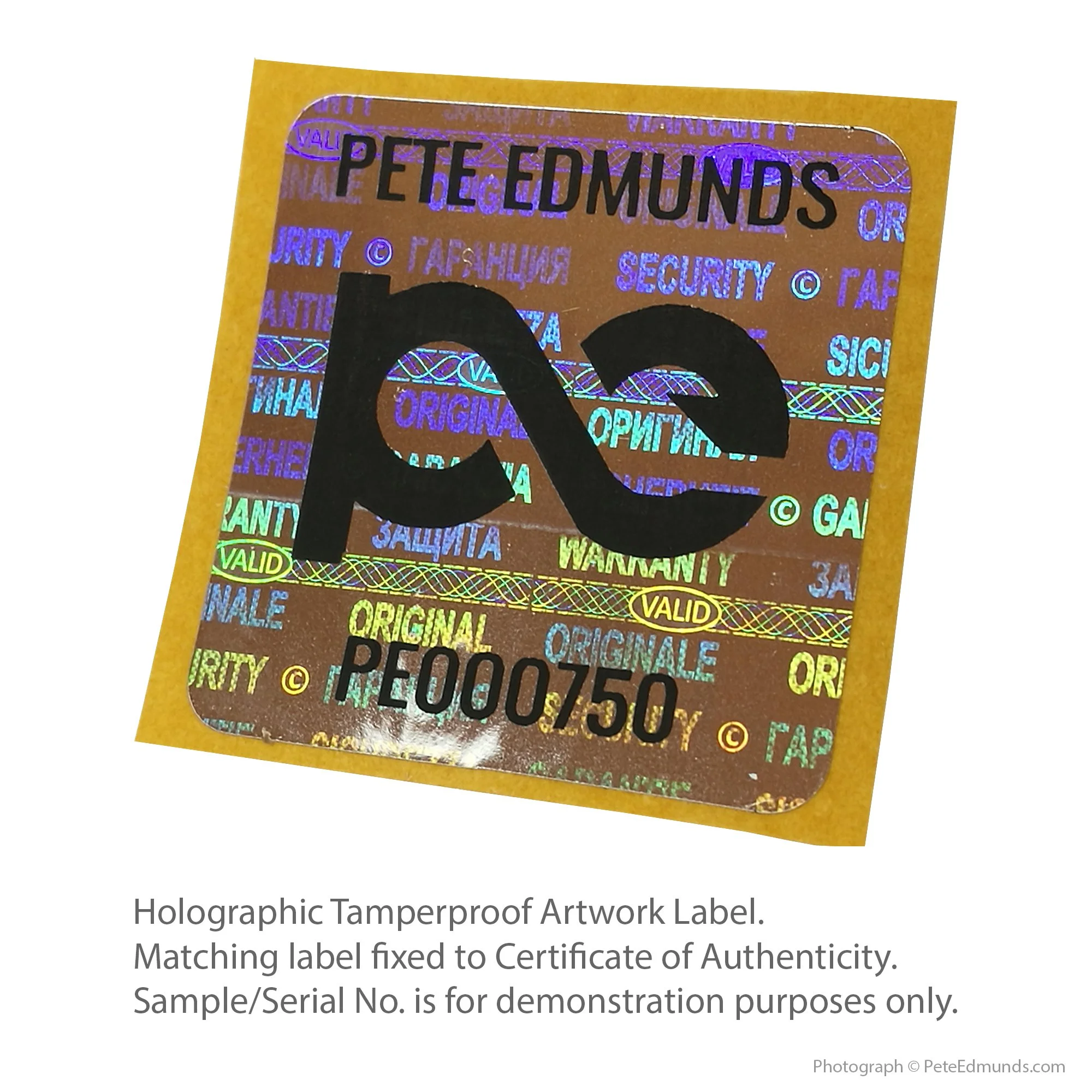 Holographic tamperproof artwork label by Pete Edmunds, showing unique serial number and security markings, with explanatory text about authenticity and matching certificate.