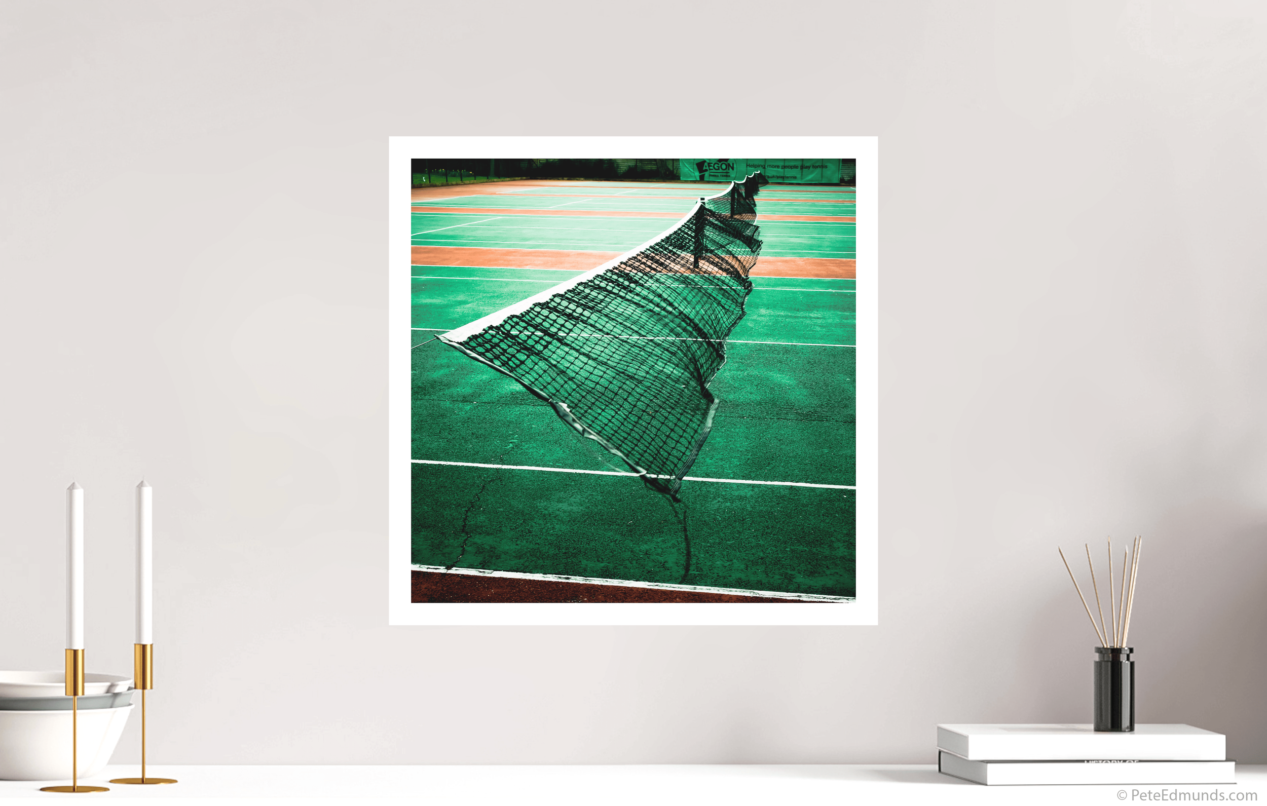 Fine art print Courting Attention by Pete Edmunds, 40 × 40 cm with 2 cm white border, displayed above a minimalist sideboard in a bright interior.