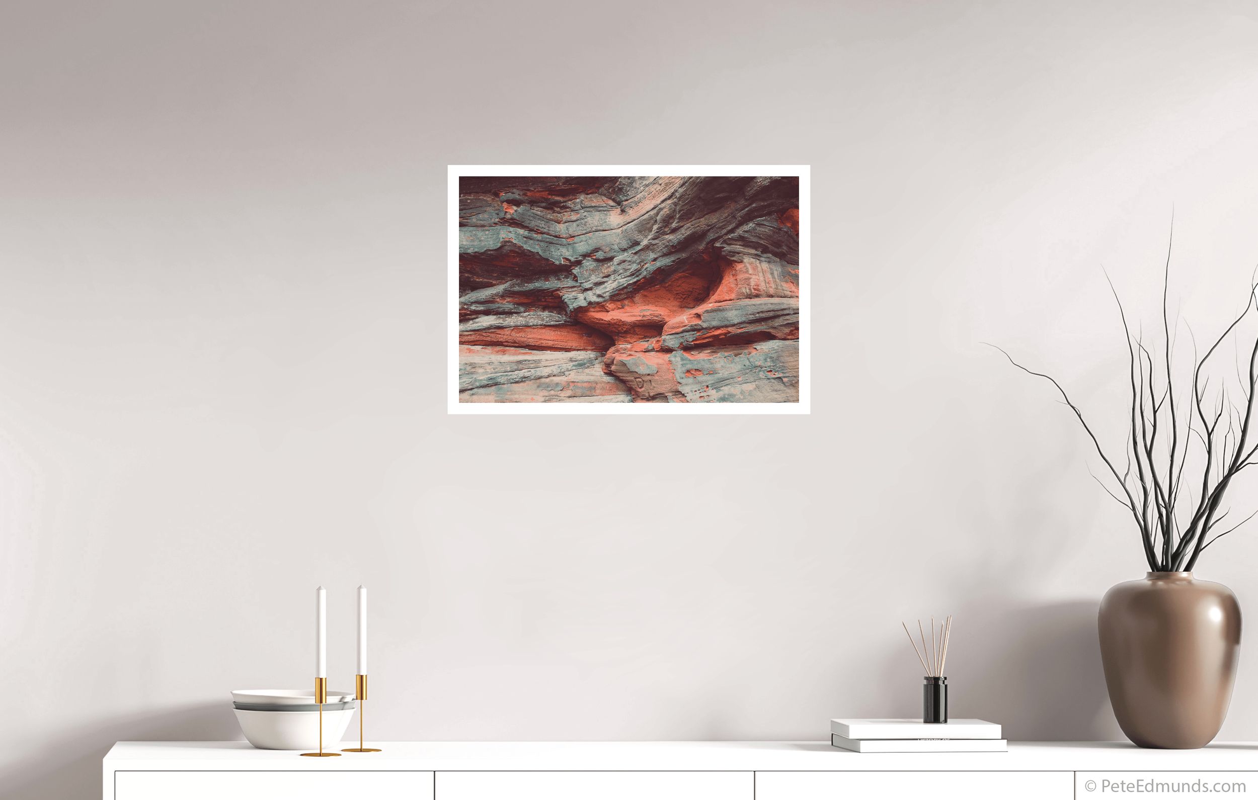 Fine art print Sandstone Stories – “Di” by Pete Edmunds, 60 × 40 cm with 2 cm white border, shown above a white sideboard in a modern interior.