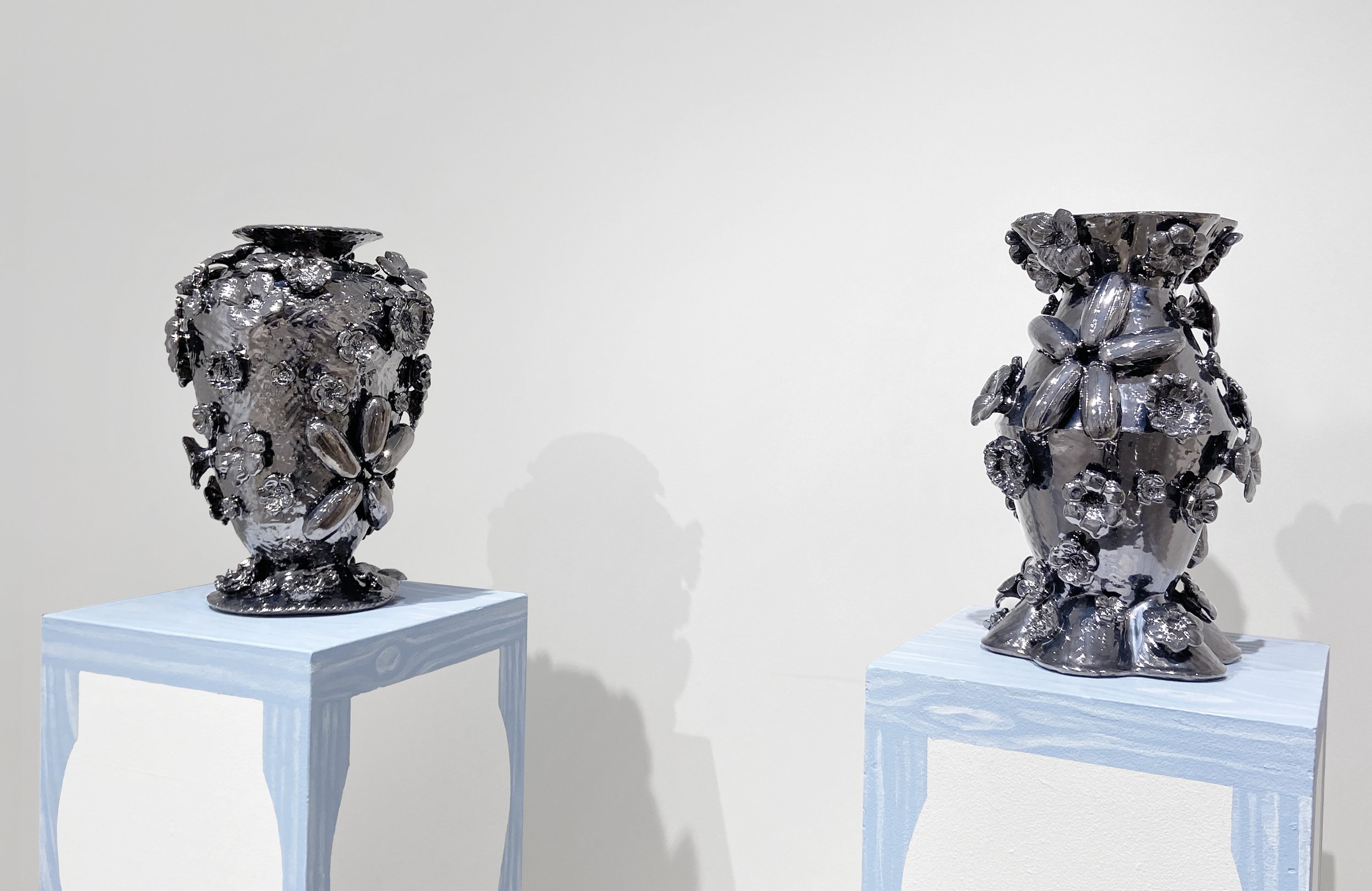  (Left) Mirror Vase 4, 2024, earthenware, glaze, 18” x 12” x 12”  (Right) Mirror Vase 2, 2024, earthenware, glaze, 17.5” x 12” x 12” 