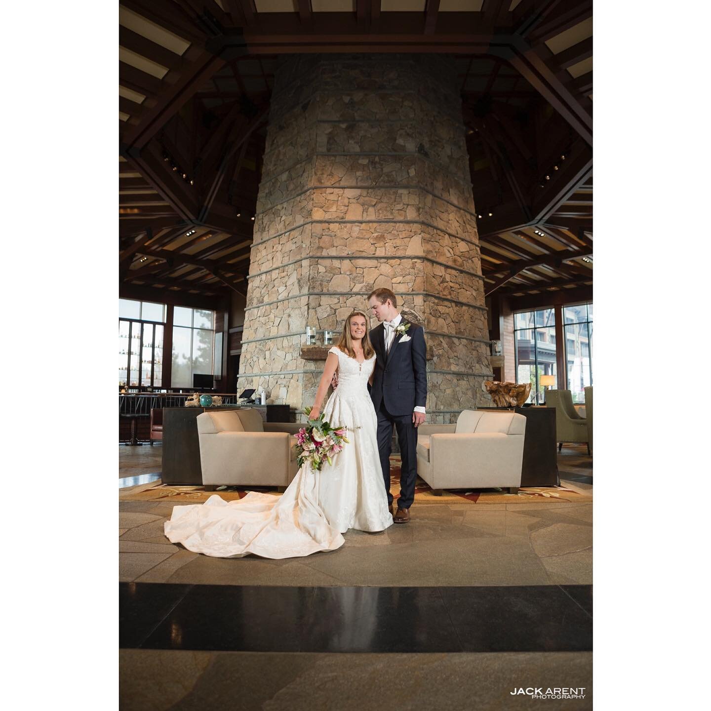 Corinne &amp; Adam posing in front of the three story fireplace at the #ritzcarlton in #laketahoe prior to their #covidwedding - #wedding #bestdayever #california #sierras