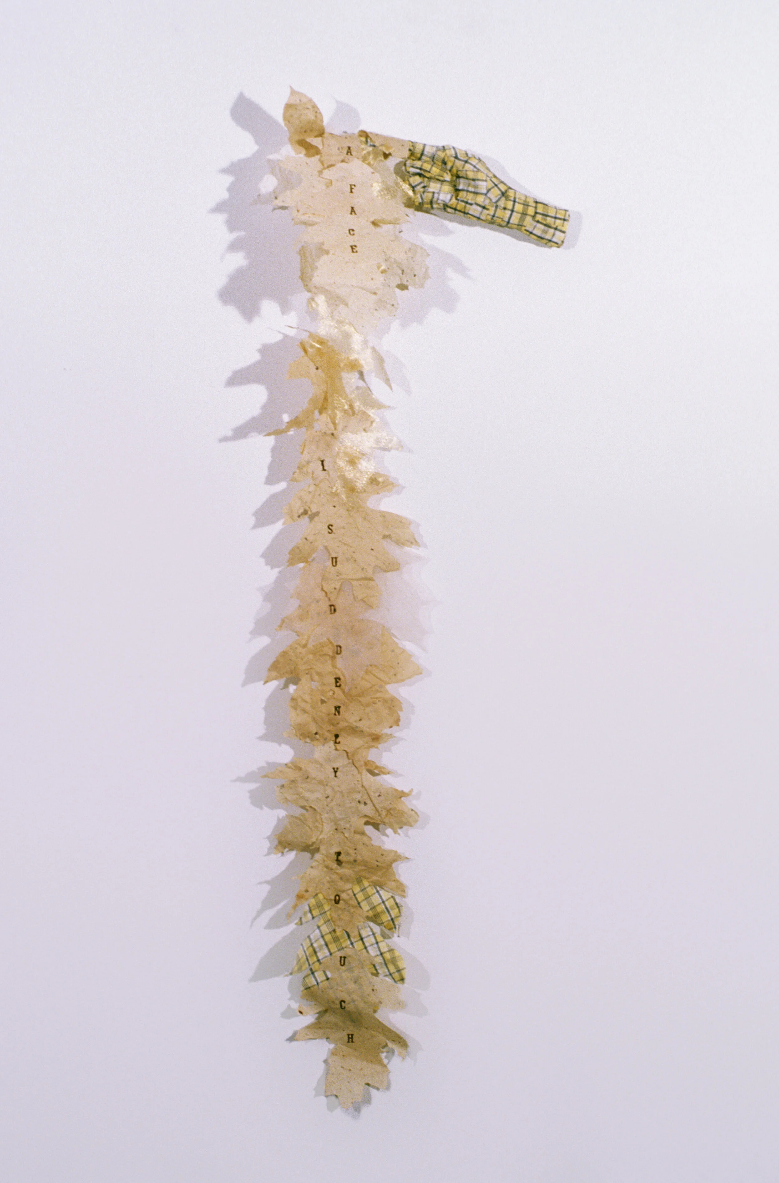 Lesley Dill, “I Suddenly Touch,” 2002, fabric cotton, ribbon, glue, thread, ink, 35 1/2” x 10” x 2”