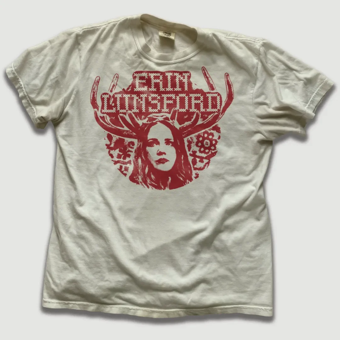 T-shirt featuring Erin Lunsford antlers graphic.