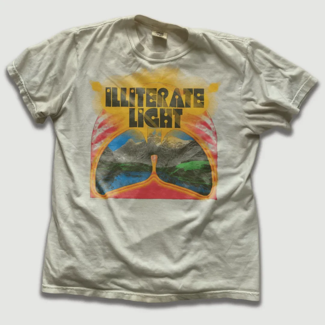 Light-colored T-shirt featuring Illiterate Light “Lungs” design.