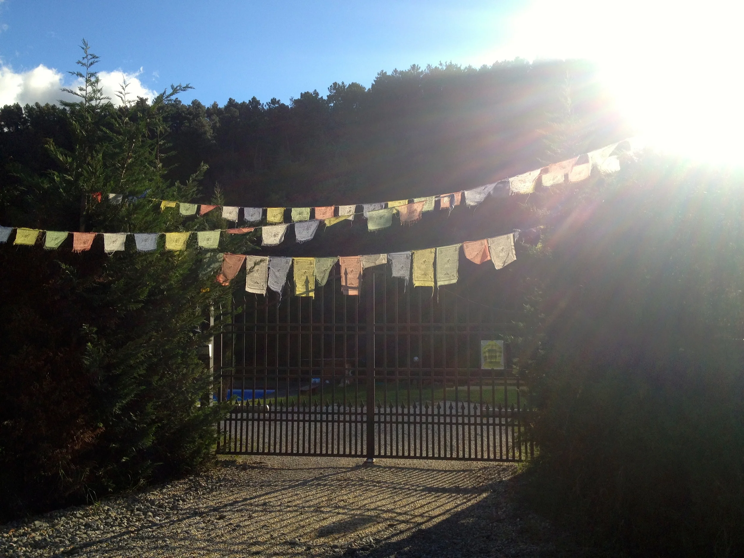Tibetan prayer flags outside a property along the Via Francigena near Lucca, Italy