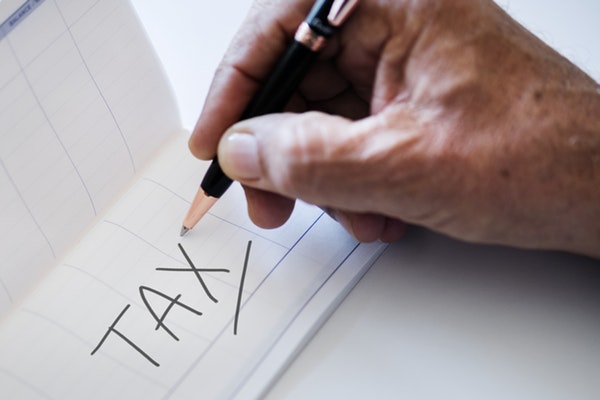 Person with word taxes.jpeg