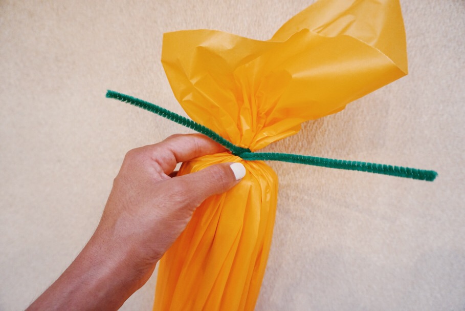 Take your fuzzy stick and wrap it around the top. The wire in the stick keeps it secure and tight.