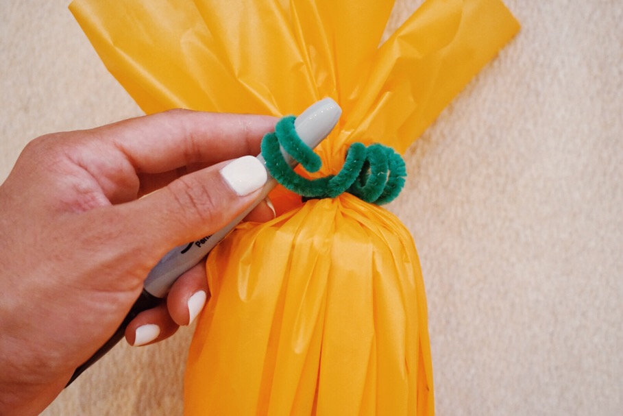 Using the end of your pen, wrap the fuzzy stick around it to create little curls for the pumpkin leaves. 