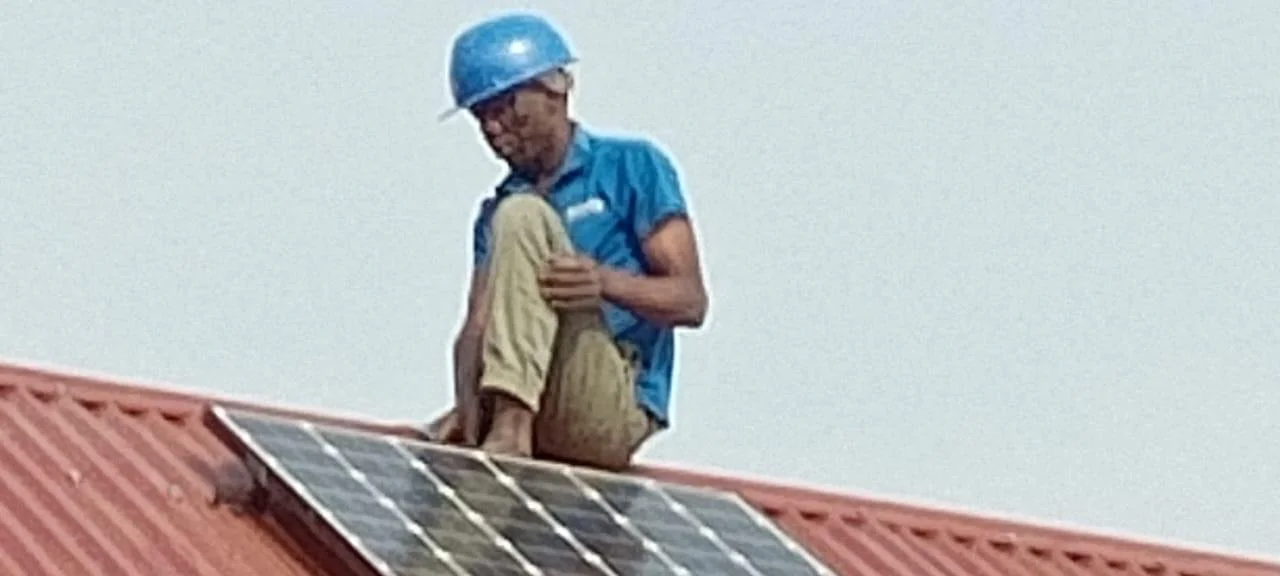 fitting the solar panels_2.jpeg
