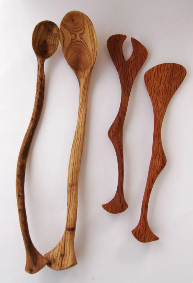 Carved wooden spoons and salad servers