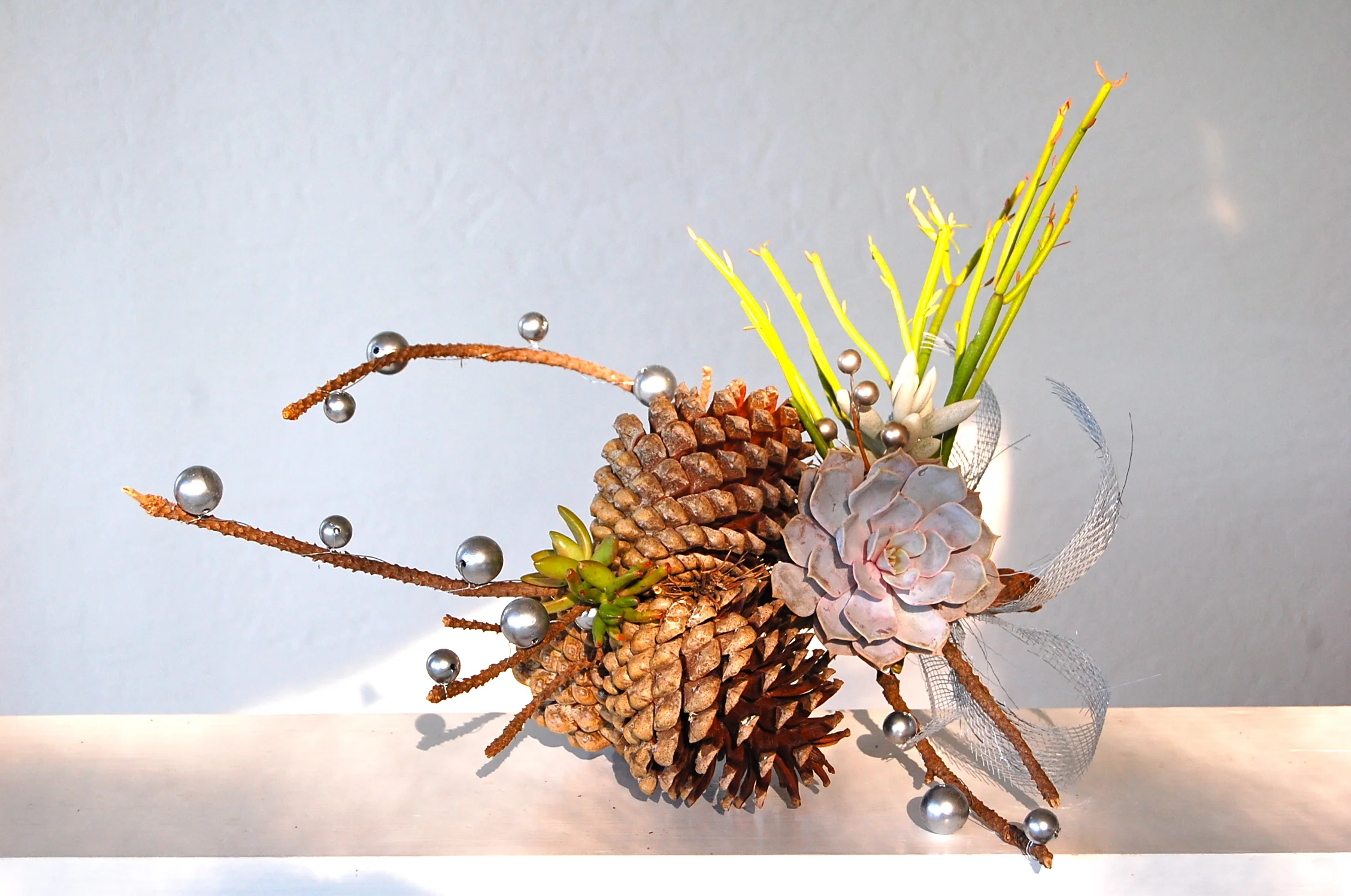 SMALL PINECONE BRANCH 19"w x 9"h – $65.