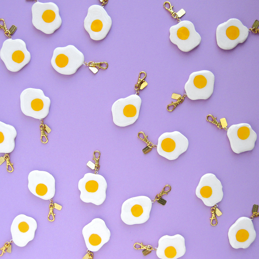 fried eggs with different yolk placement on both sides