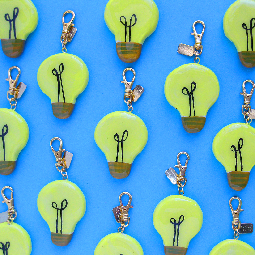lightbulb charm to inspire bright ideas, same design on both sides