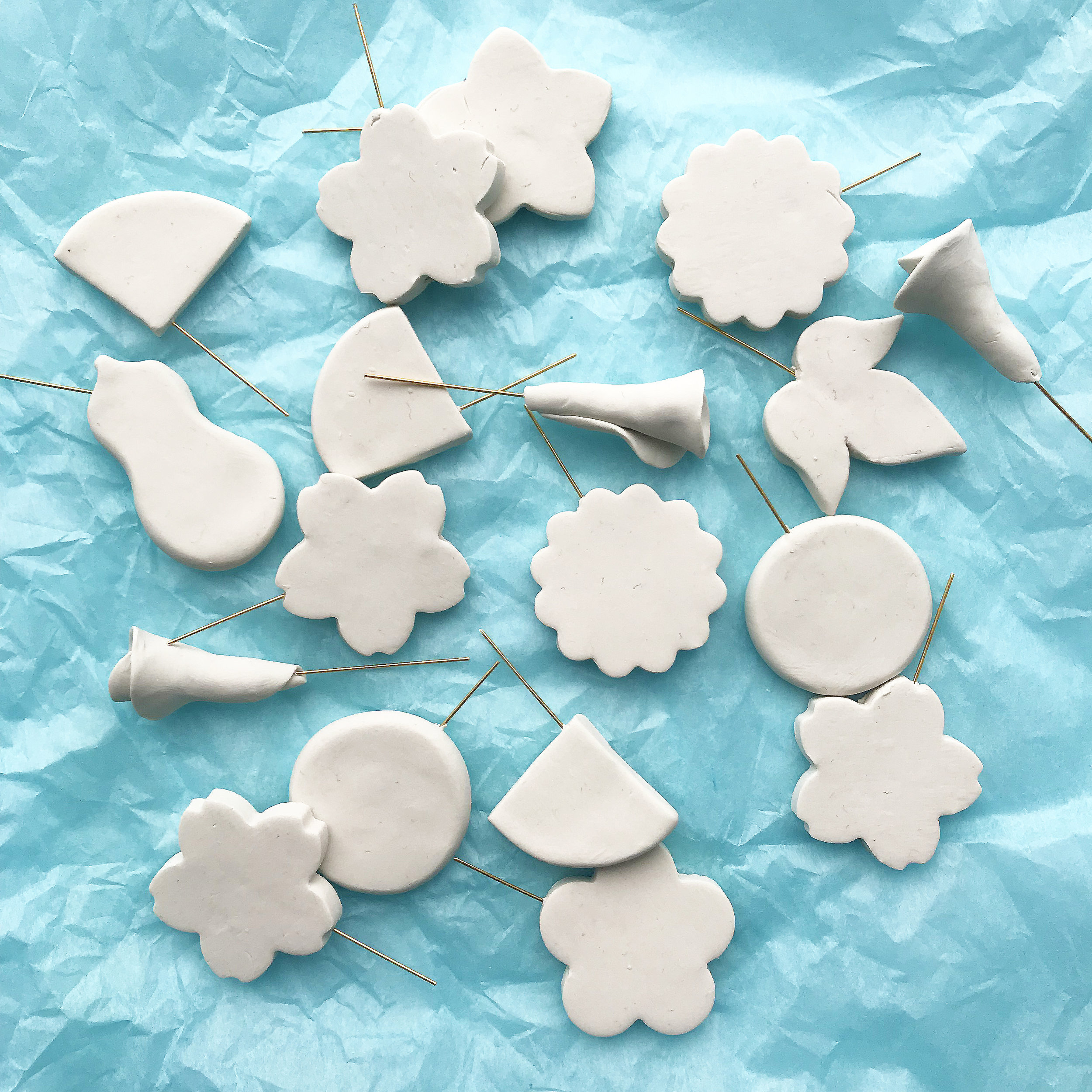  Freshly baked charm blanks, ready to be painted. 