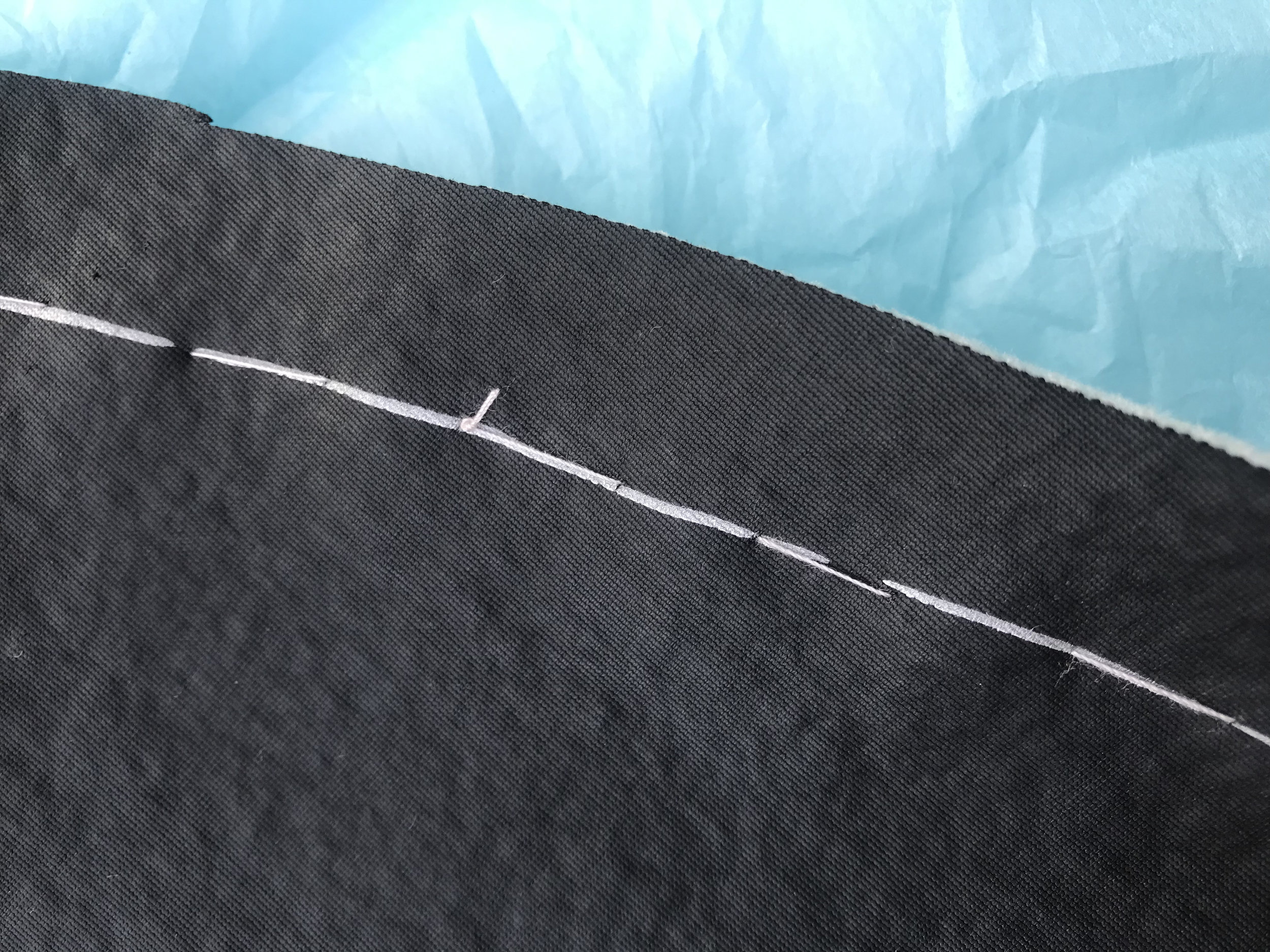  Here you can see the line I traced in silver Sharpie on the back of my collar piece. Then I basted along that line so I could see it on the front of my fabric, too. The seam allowance is 5/8”. 