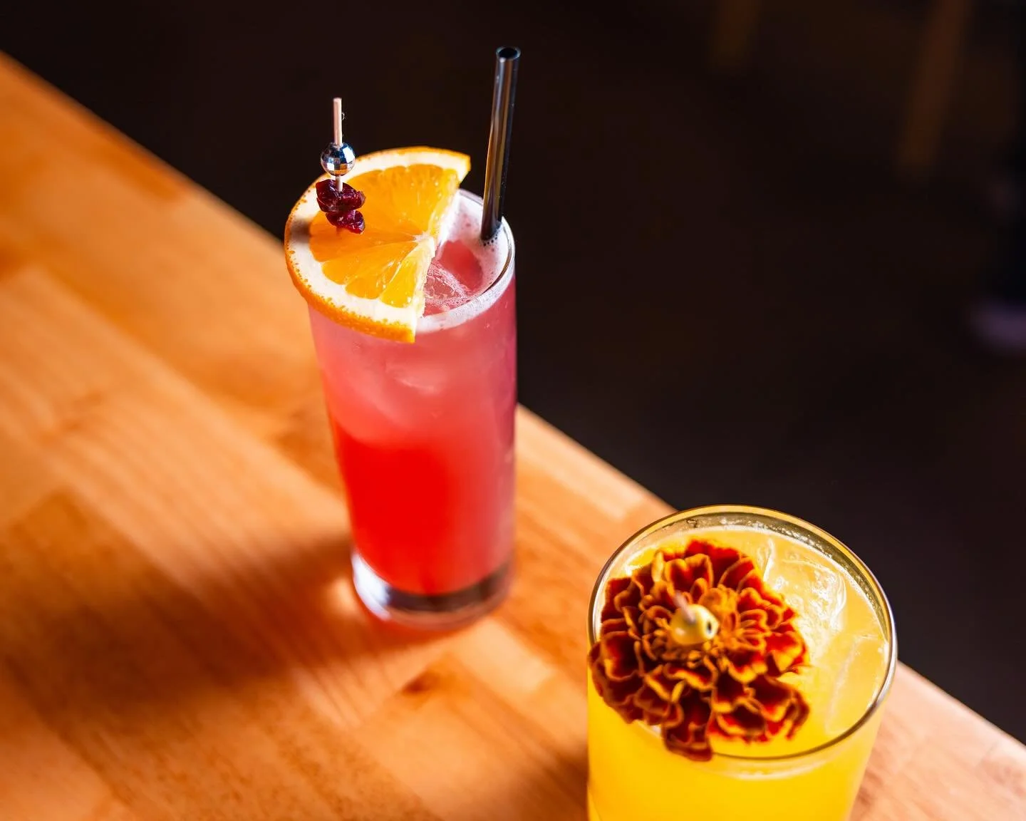 Cool weather calls for fall cocktails 🍁 Feat. Burgundy On My T-Shirt with house made vanilla vodka, cranberry &amp; blood orange (created by @queennovie_ ) and Sunstone Evolution with tequila, spiced pear, ginger, and turmeric (created by @chinstvgr