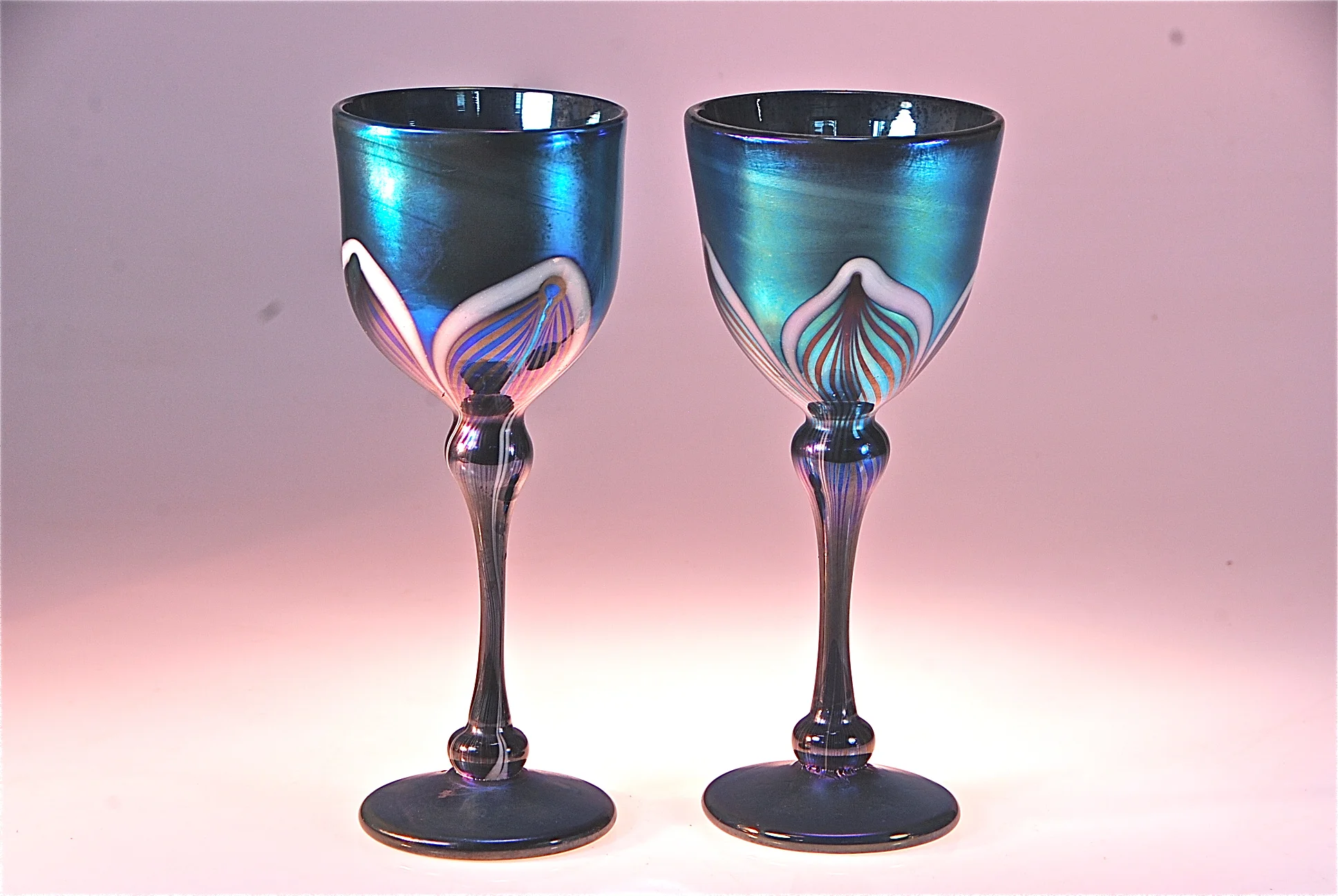 these are a couple of new Wine Goblets that are on the shopping cart. Blue Luster decorated with a feather pattern. Hand blown glass by rick strini 2014