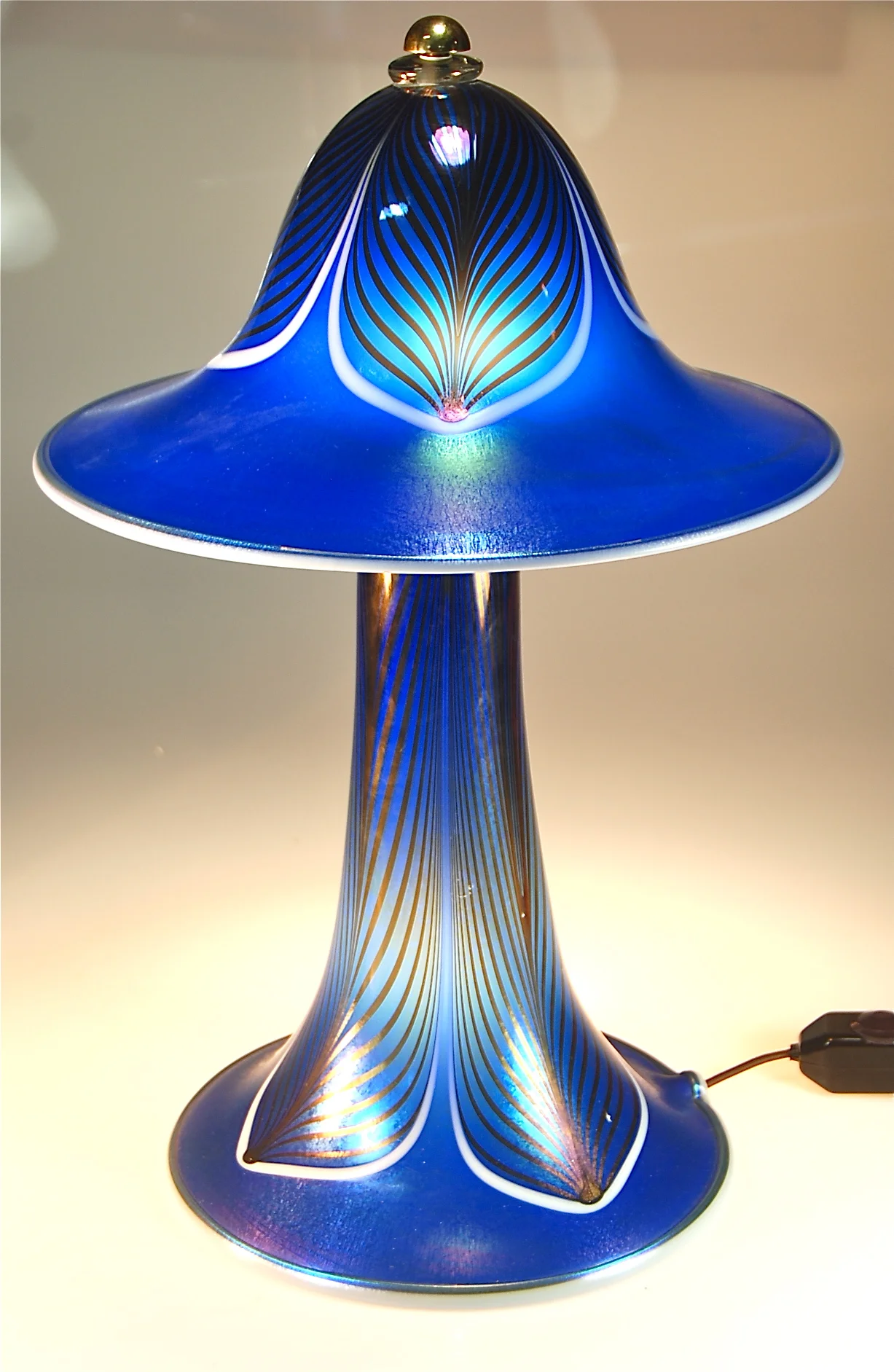 A new Blue Luster Lamp with a feather pattern. 13" d top shade x 19" tall base illuminated as well as top with candelabra bulbs.