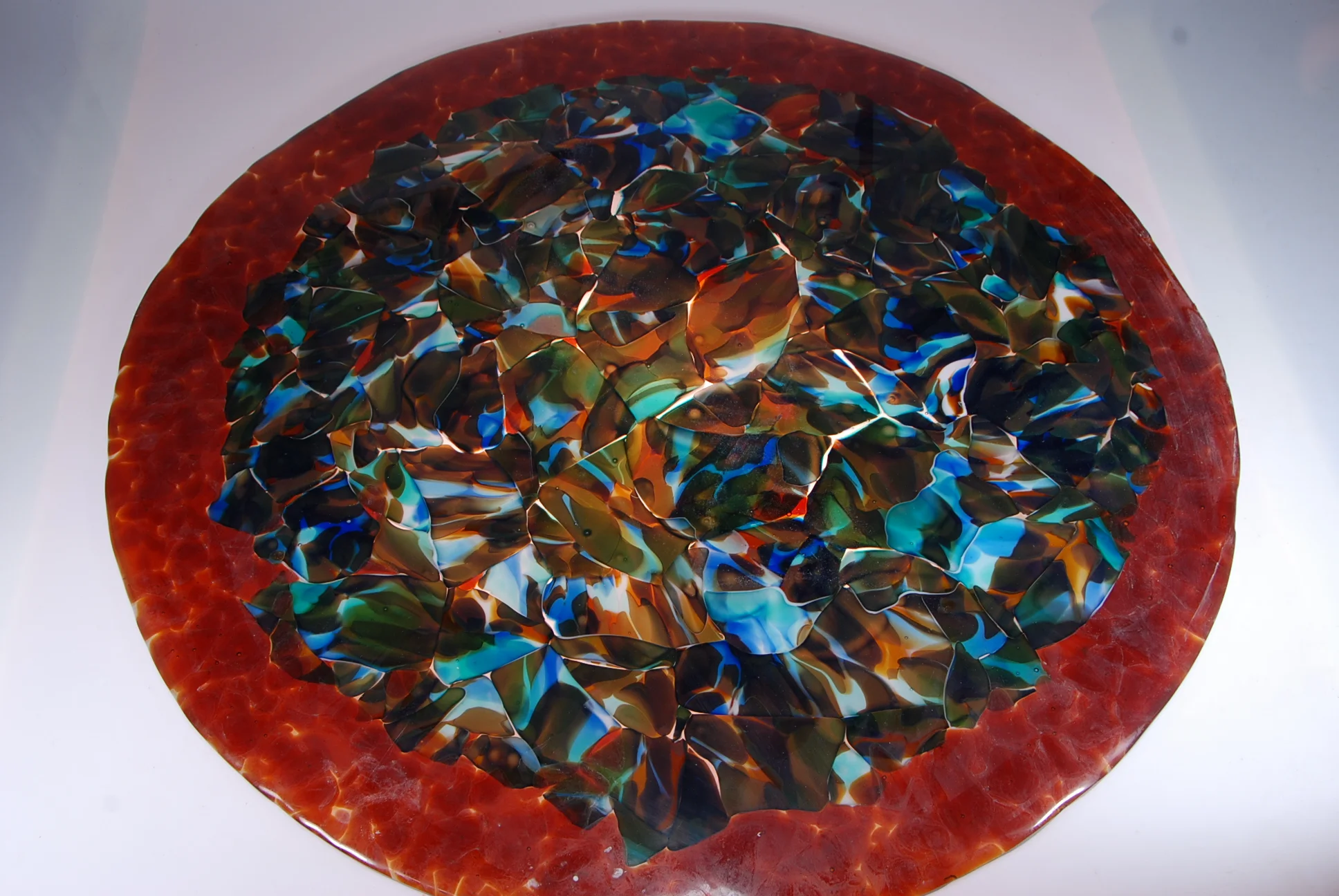 This is the other side from yesterdays post. Sfumato blown glass , fused into a 30" diameter platter to be a dome chandelier or a bowl. Rick Strini strini art glass. 2015 