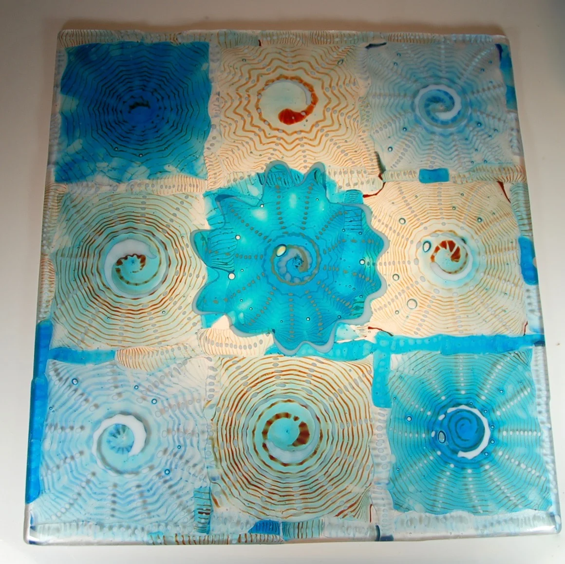 24" x 26" Blown Rondels, then cut and drilled and finally fused.