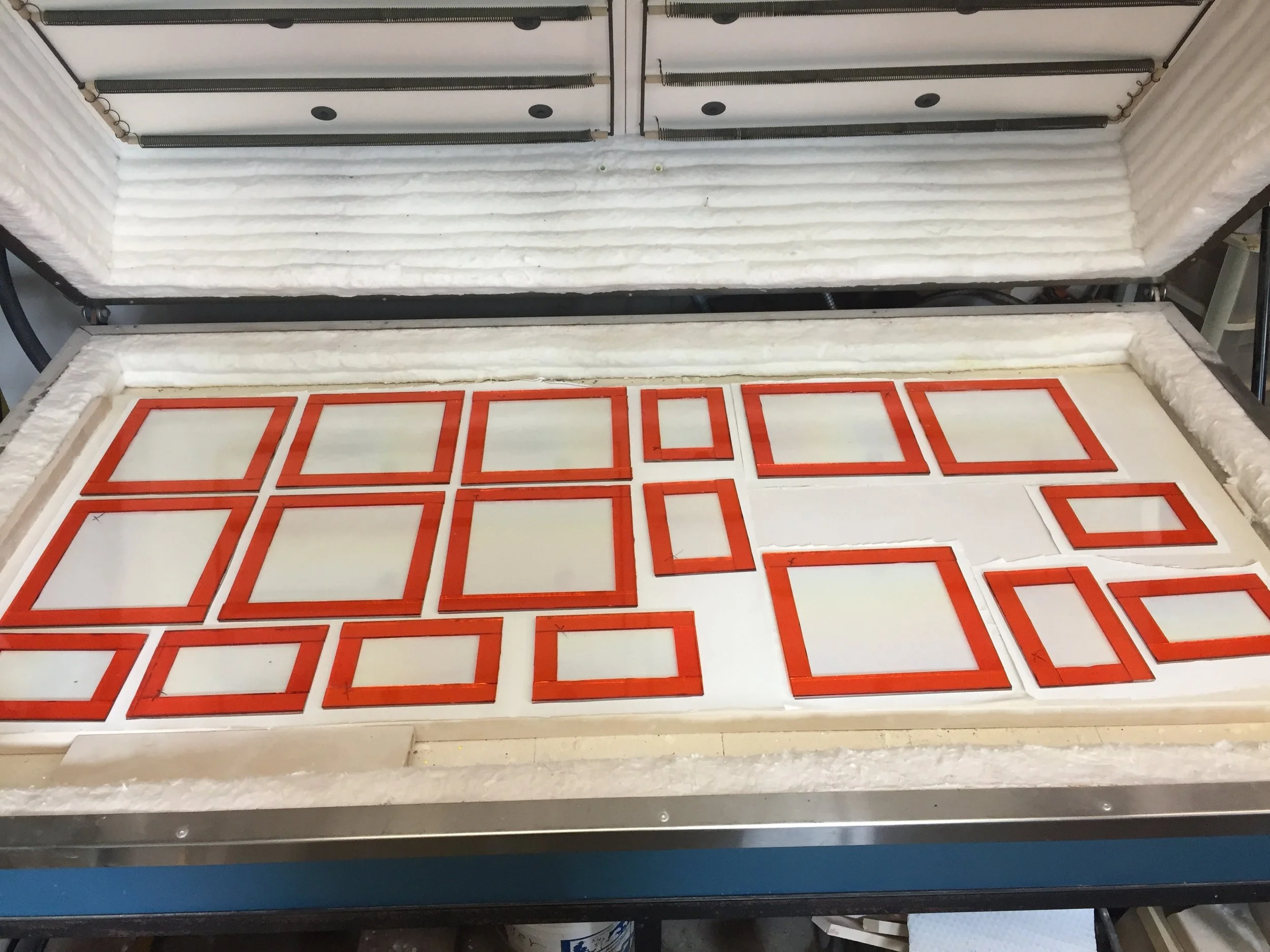 This is the 2nd step after cutting the glass, fusing. Dinner ware set up. 5x 8" serving trays, and 10" dinner plates. strini art glass. 
