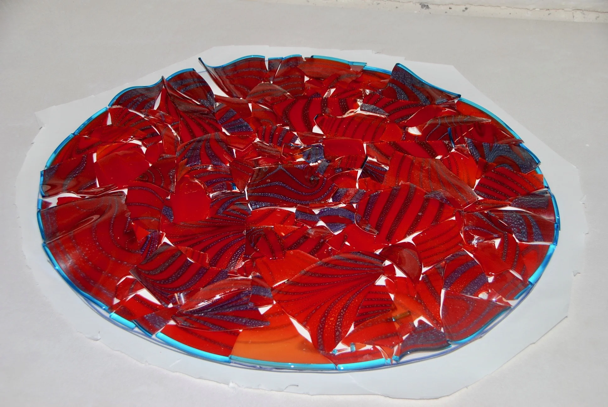 New project for wonderful client. Ruby burgandy mosaic Treasure bits of blown glass about to be fusedthen slumped. Strini Art Glass 20 x 26" 