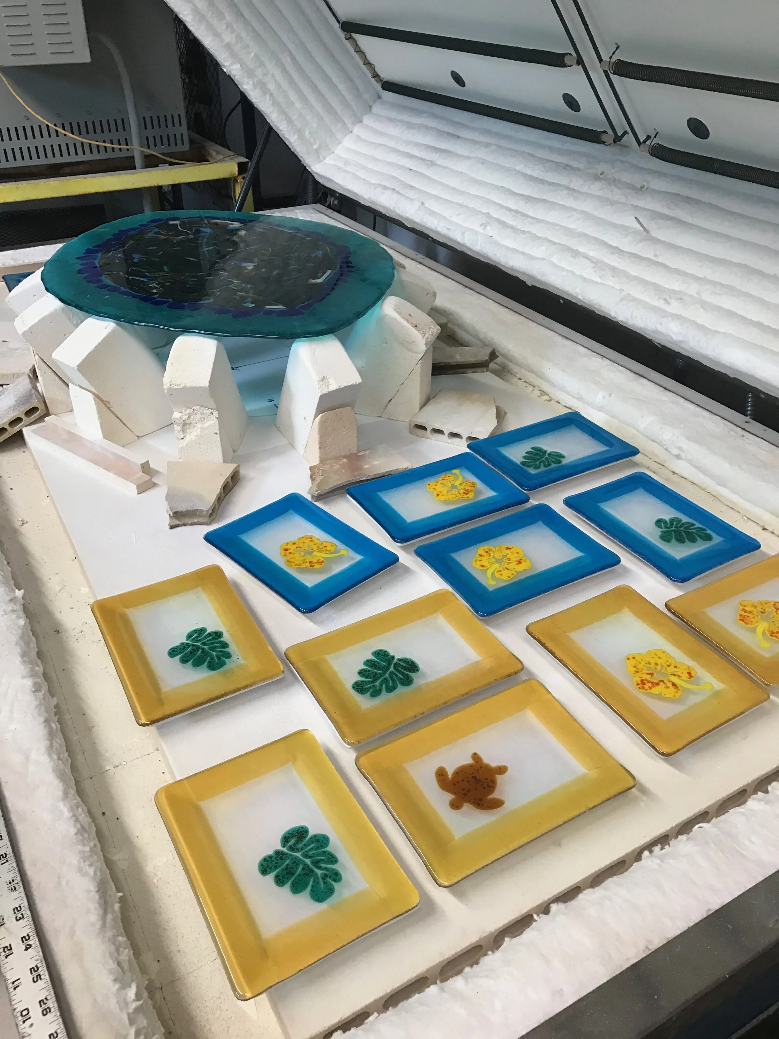 experimental platter and some production for the Maui Crafts Guild , Monstera Leaf plates with Hibiscus and Honu plates. strini circa 2017