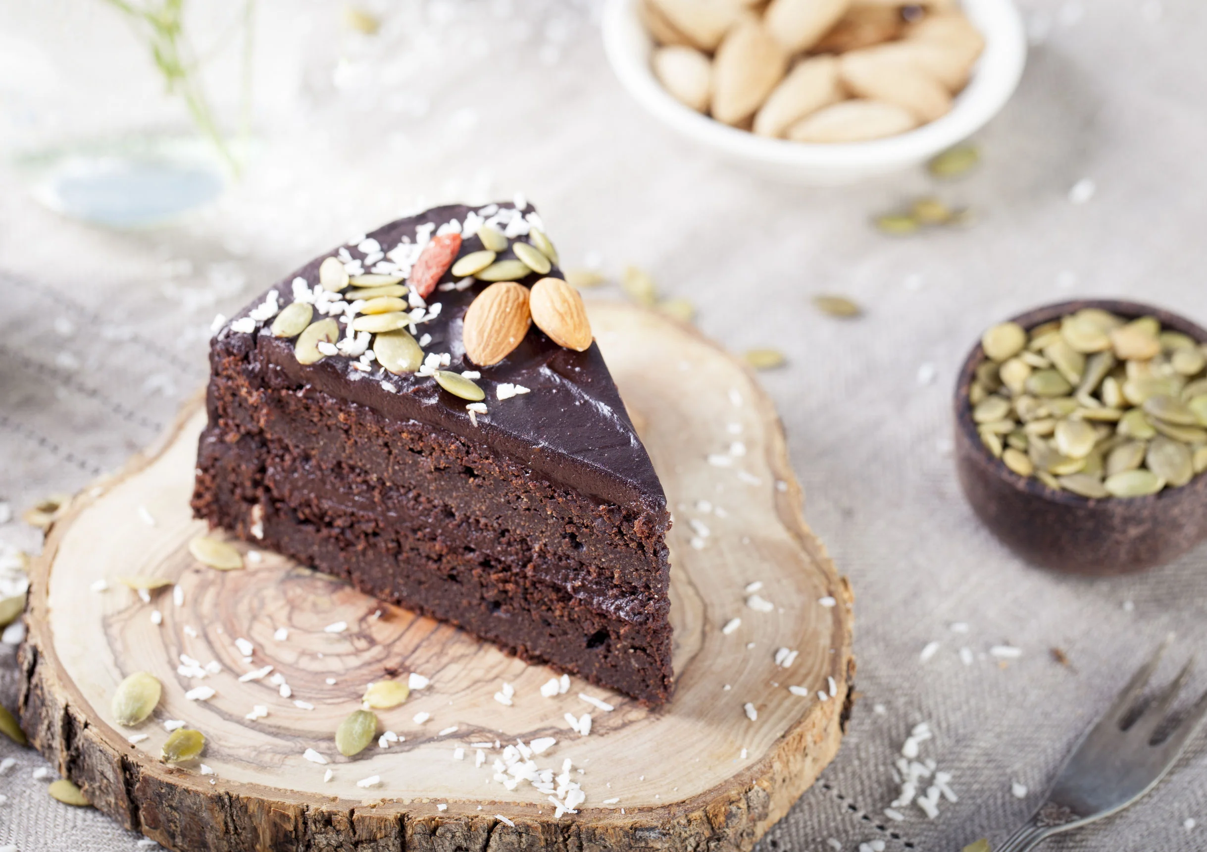 Vegan chocolate beet cake with avocado frosting, decorated with nuts and seeds.jpg