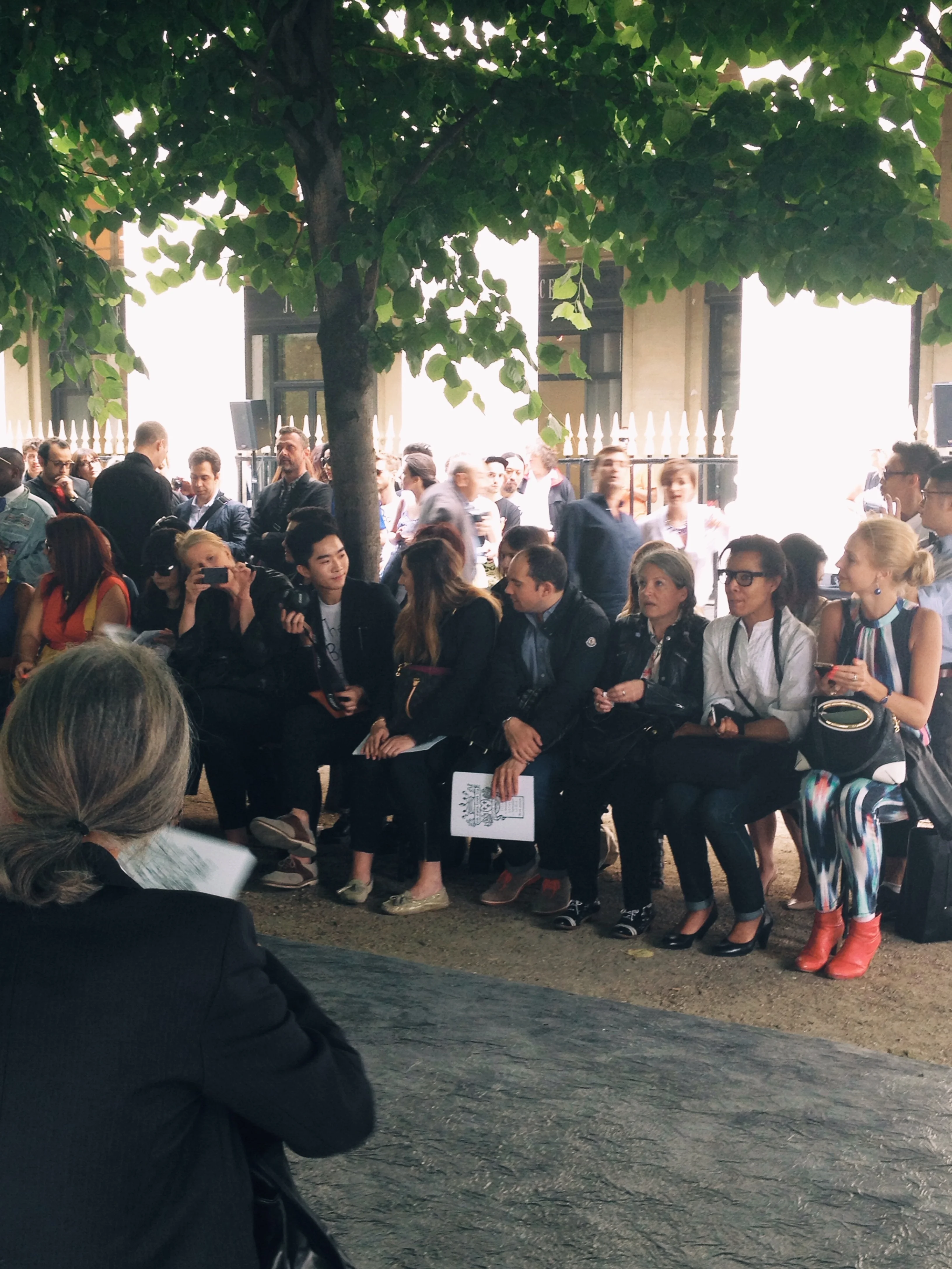 Spotted chatting away on the front-row