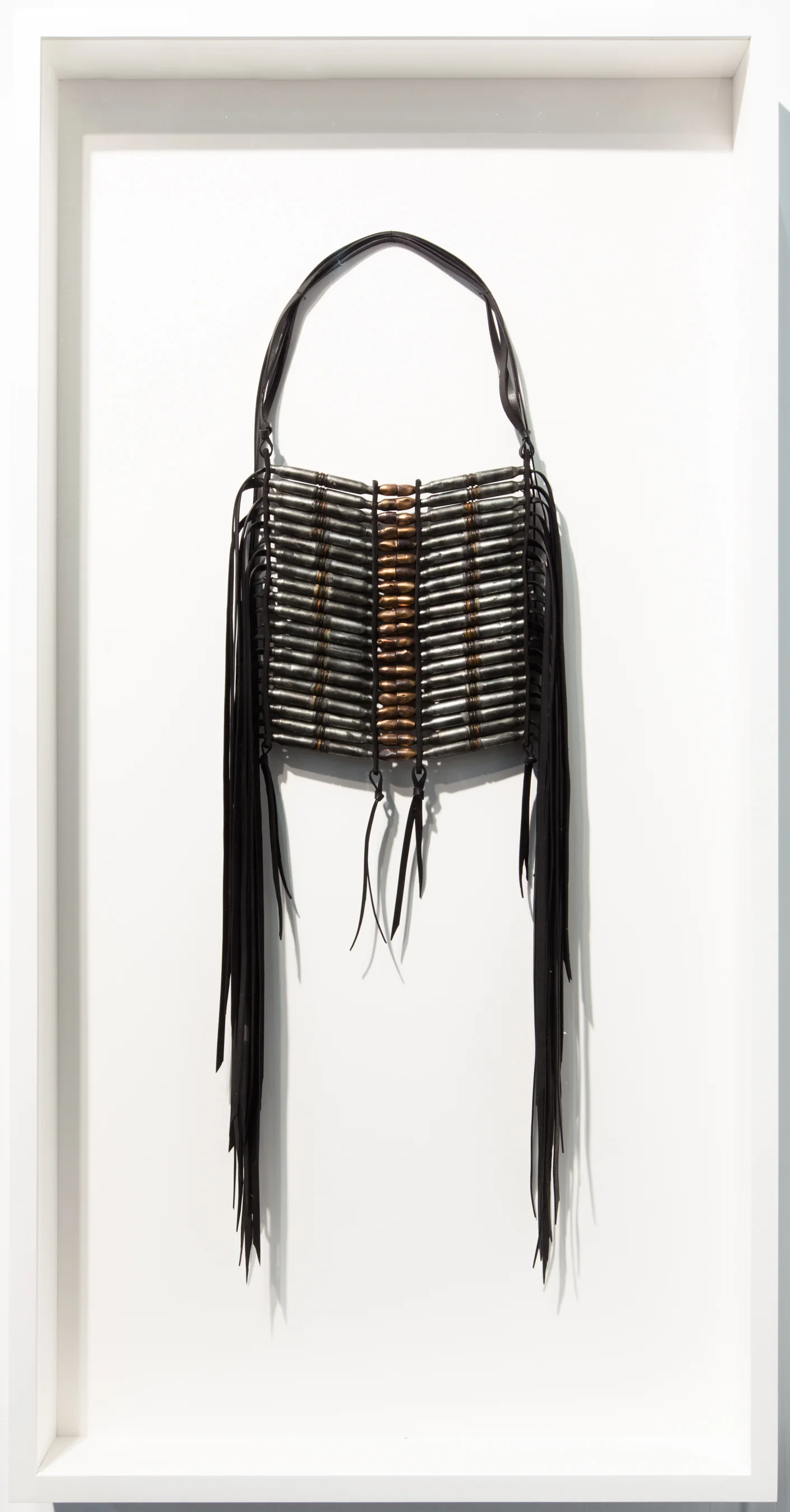 Dave Cole-Breastplate No.7 (after Lakota Oglala (Sioux) artifact, date unknown, from a photograph dated 1877)-2013-Military Surplus Gasketing, Butyl Rubber, Military Shell Casings, Recovered Military Projectiles-41x21x3.75-framed.jpg