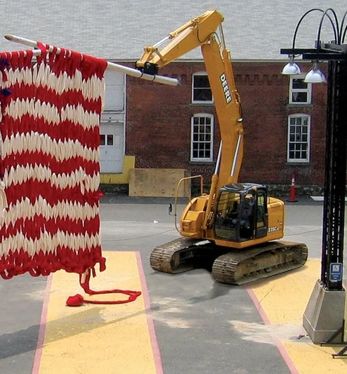 acrylic felt with excavators and aluminum utility poles Actually knit on site with the machines over the course of a week, th completed flag as displayed is approximately H20' x W20' x D1'