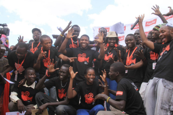 FilmAid-trained refugee filmmakers pose for a picture at the 9th Annual Film Festival. 