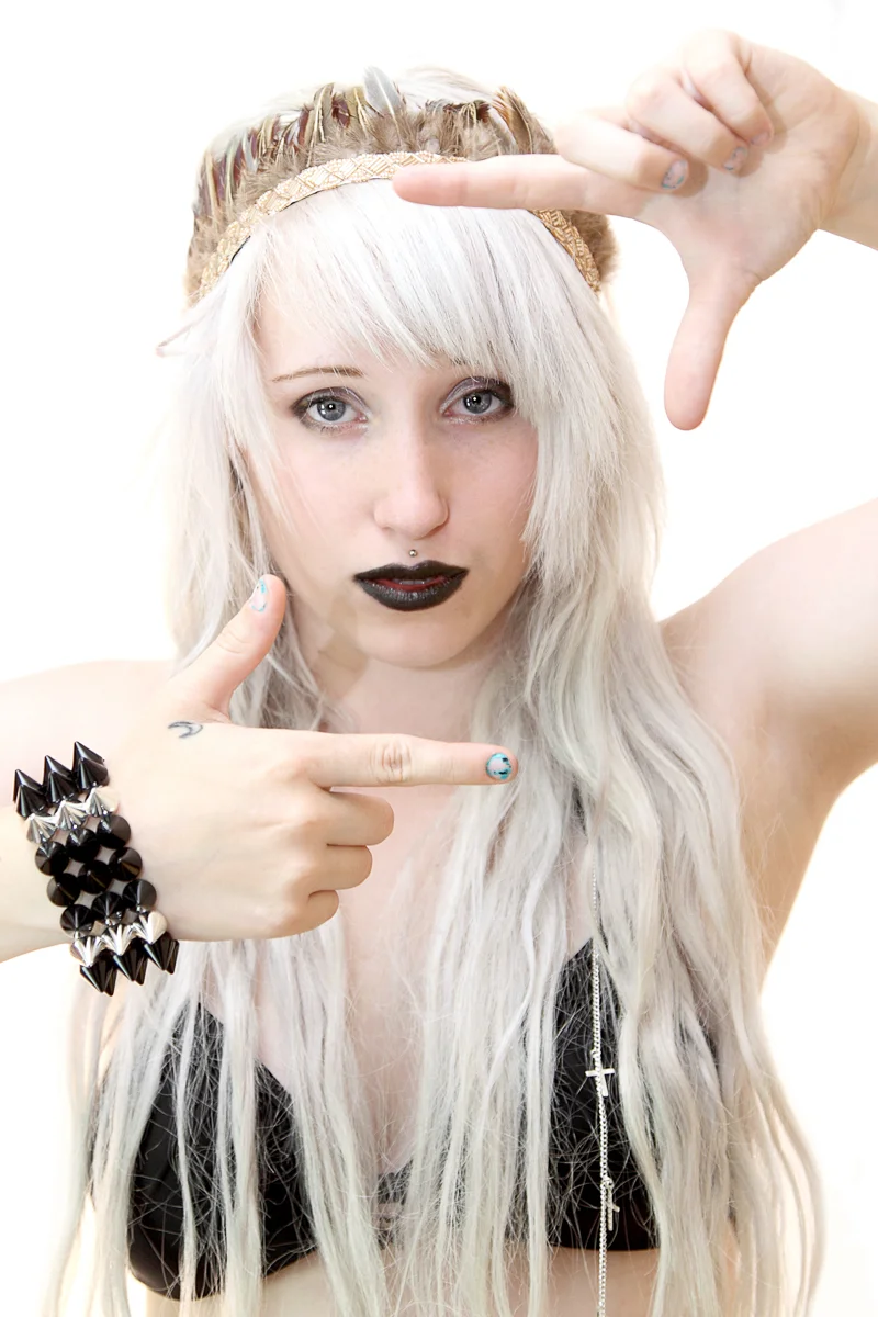 Teen female model framing herself in a picture