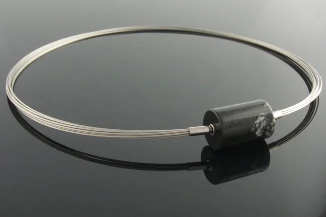 Steel wire multistrand necklace with black onyx cylinder clasp