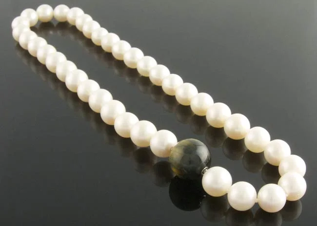 Crem freshwater pearl necklace with interchangeable falcon's-eye ball clasp