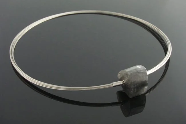 steel wire multistrand necklace with interchangeable triangular grey quartz clasp