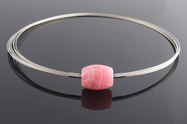 Steel wire multistrand necklace with rhodochrosite feature clasp