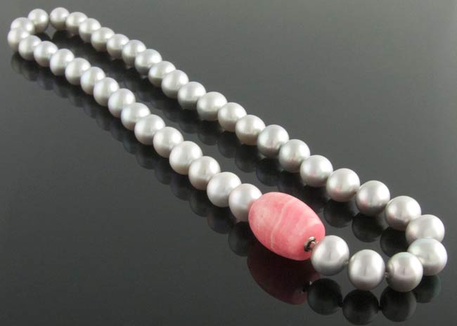 Grey freshwater pearl necklace with rhodochrosite feature clasp