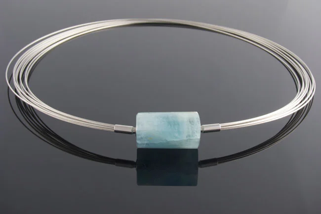 Steel wire multistrand necklace with aquamarine triangular barrel clasp