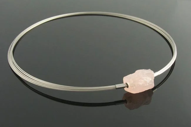 Steel wire multistrand necklace with rose quartz nugget clasp