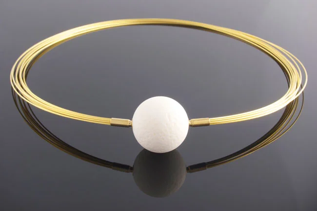 Gold wire multistrand necklace with white coral feature clasp