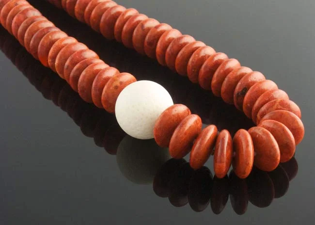 Red coral rondelle necklace with white coral feature clasp